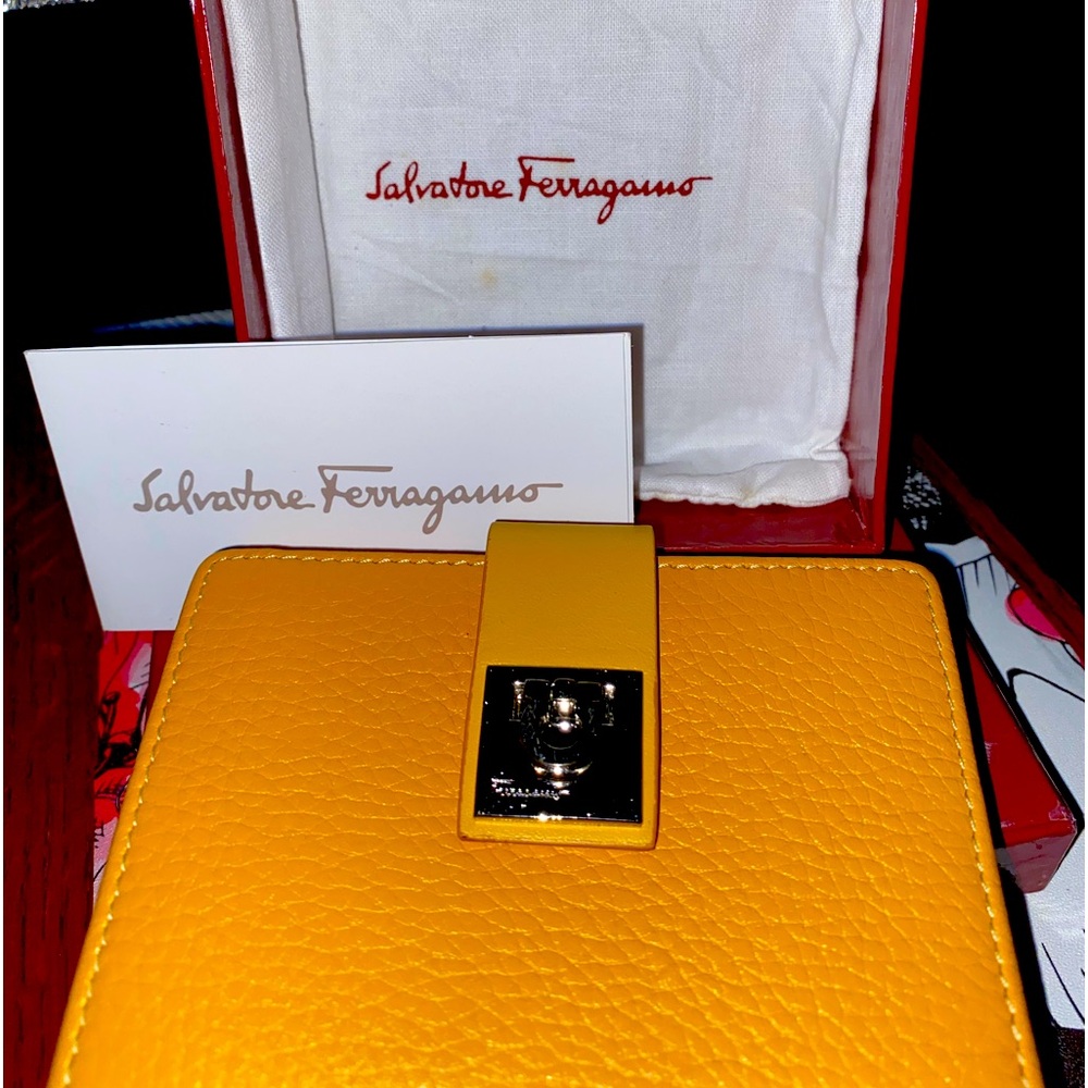 New Gold Salvatore Ferragamo trifold wallet, complete with dust bag and box.